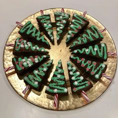 a cake with green frosting and candy canes on it that says happy new year