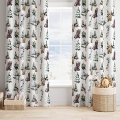 the curtains are decorated with animals and trees