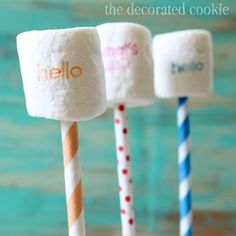 three marshmallows with the word hello written on them are lined up next to each other