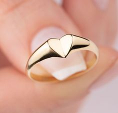 Our signet heart ring is 14k solid gold. Our gold heart ring has a unique style with looks like a folded heart. It fits your all outfit and becomes your everyday ring. When you think of our 14k gold heart ring as a gift, it is a product that will make your loved ones happy on their birthday, valentine's day, mother's day, anniversaries, graduations, or other special days. Also, it can be a perfect gift for yourself. :) 🎁 If you want, you can add a gift note for your loved ones. It arrives in a Minimalist Heart Promise Ring With Polished Finish, 14k Gold Open Heart Ring With Heart Charm, Yellow Gold Open Heart Ring With Heart Charm, Heart Shaped Signet Ring For Wedding, Minimalist Heart Ring With Charm For Promise, Heart-shaped Signet Ring For Wedding, Minimalist Heart Shaped Signet Ring For Promise, 14k Gold Rings With Heart Charm, Minimalist Signet Ring For Valentine's Day Anniversary