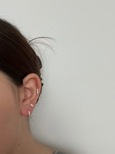 a woman with ear piercings on her ears