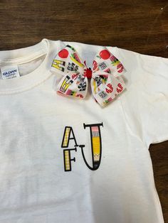 This cute tee is personalized for your little ones back to school days! We have a matching bow available in another listing! School Grades, Kids Graphic Tees, School Days, Kids Tshirts, Back To School, Gender Neutral, Graphic Tees, Kids Outfits, Monogram