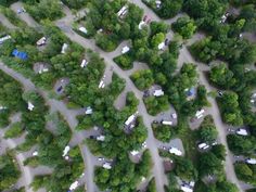 an aerial view of a parking lot in the woods