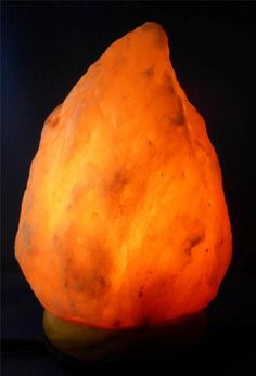 a large orange rock sitting on top of a table