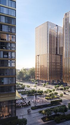 two tall buildings next to each other in a courtyard area with trees and bushes on both sides