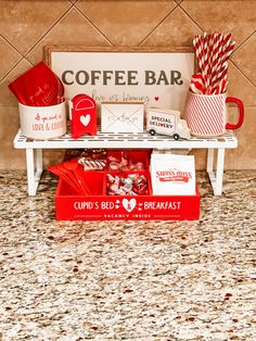 a coffee bar with red and white items on the counter next to a sign that says, cupid's & blvd breakfast