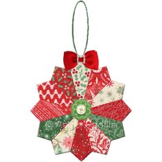 a christmas ornament with a red bow hanging from it's center piece