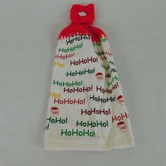 a white towel wrapped in red and green fabric with the words hohohol on it