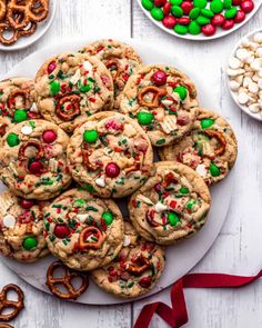 cookies and pretzels are arranged on a white plate