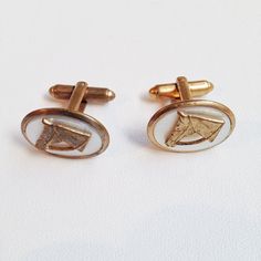 "Mother of Pearl oval inset equestrian theme cuff links, for the horse lover. Base in gold tone metal, circa 1960's. MEASUREMENTS: 7/8\" Length 5/8\" Height Perfect for weddings or formal evenings out and about. For other great menswear options, please see our Vintage Mens Section here: https://www.etsy.com/shop/modernmatters?ref=seller-platform-mcnav&section_id=10357977 Ships for free if you send me a United States address. Please see our shipping section for all other destinations. Thanks for Classic Formal Jewelry With Horse Design, Formal Accessories, Modern Men, Gifts For Horse Lovers, Tie Accessories, Suit And Tie, Cuff Links, Wedding Groom, Horse Lover