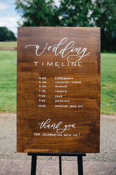 a wooden sign with writing on it that says wedding time and thank you for celebrating with us