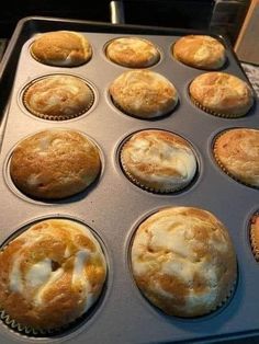 muffins are being baked in a pan on the stove