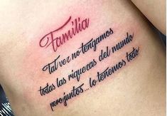 a woman with a tattoo on her stomach that says,'famila ta vie no teteminos '