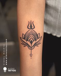 a woman's arm with a lotus tattoo on the left side of her body