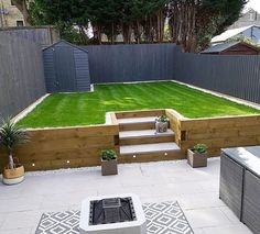 a backyard with grass and steps leading up to it