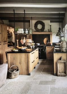 a kitchen filled with lots of wooden cabinets and counter top space next to an oven