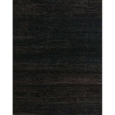 an area rug with black stripes on it