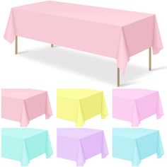 a table covered in pink, yellow and blue cloths