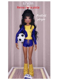 a doll is holding a soccer ball in her hand and wearing blue shorts with yellow socks