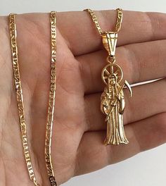 "18K GOLD FILLED CADENA DE LA SANTA MUERTE 22\" LARGO /.. PARA PROSPERIDAD, BUENA SUERTE,PROTECCION,AMOR Y DINERO. DIJE: 52x15mm 18K GOLD FILLED GRIM REAPER NECKLACE 22\" LONG. FOR GOOD LUCK ,PROSPERITY AND PROTECTION. PENDANT : 52x15mm" Art Prints Boho, Elephant Necklace, For Good Luck, Pompano Beach, Grim Reaper, Fashion Jewelry Necklaces, Cute Jewelry, Chain Styles, Long Necklace