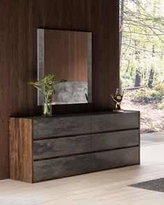 a modern dresser and mirror in a room