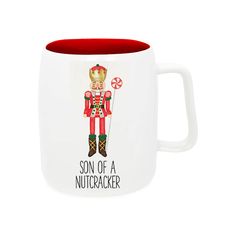 a red and white coffee mug with a nutcracker on the front, says son of a nutcracker