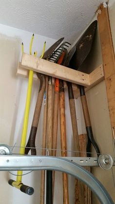 there are many different types of baseball bats in the closet