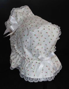 A beautiful Victorian style baby bonnet. Fabric is white searsucker with rosebuds. Lining is white . Bonnet has an extended back and is trimmed with white lace. Bows and extra long ties are made of white double sided satin ribbon. Size/ Measurement from under ear lobe around top of head to under other ear lobe preemie / 10 inches 0-3 months / 11 inches 3-6 months / 12 inches 6-9 months / 13 inches 9-12 months / 14 inches 12-18 months/ 15 inches Cute White Baptism Hat, Cute Fitted White Bonnet, Cute White Fitted Bonnet, White Cotton Bonnet As A Gift, White Cotton Bonnet As Gift, White Cotton Bonnet For Spring, Spring White Cotton Bonnet, White Bonnet, Newborn Bonnet