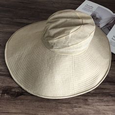 Introducing our Elegant Japanese-Inspired Extra Large Brim UV Protection Sun Hat, the perfect blend of style and functionality. Designed to provide maximum sun protection while maintaining a chic and sophisticated look, this hat is an essential accessory for any outdoor occasion. High-Quality Material: Made from premium linen for durability and breathability. Extra Large Brim: Front brim measures approximately 14.5 cm, back brim approximately 18.5 cm. 360-Degree Sun Protection: Provides full cov Solid Color Packable Wide Brim Sun Hat, Flat Brim Panama Hat With Upf 50+, Panama Hat With Upf 50+ And Flat Brim, Solid Flat Brim Sun Hat With Uv Protection, Solid Sun Hat With Uv Protection And Flat Brim, Sun Hat With Uv Protection And Flat Brim, Uv Protection Straw Hat With Curved Brim, Packable Wide Brim Bucket Hat For Beach Season, Hats With Uv Protection For Beach Season