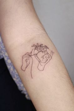 a person with a tattoo on their arm