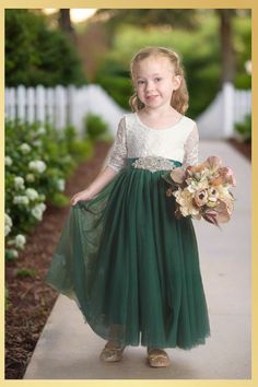 Holiday Dress in Green Looking for that special holiday dress for your little princess? Our Girls Green Christmas Dress is the perfect combination of festive and chic! The rich hunter green hue will make her feel like a fairy at a Christmas party, while the charming design will have her feeling confident and beautiful. This long sleeve, full-length piece perfectly captures the magic of Christmas. With its rich hues echoing the evergreens, your little one will shine at any special occasion. The d Green Flower Girl Dress, Green Christmas Dress, Green Holiday Dress, Ethereal Forest, Wedding Kids Outfit, Green Flower Girl Dresses, 21st Ideas, Hunter Green Dresses, Long Flower Girl Dresses