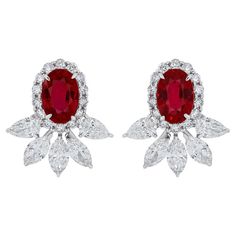 Elegant and exquisitely detailed 18 Karat White Gold Earrings, center set with 1.32Cts .Oval Shape vibrant Red Mozambique Ruby and micro pave set Diamonds, weighing approx. 1.14Cts Beautifully Hand crafted in 18 Karat White Gold. Stone Detail: Ruby Mozambique: 6x4MM Stone Weight: Ruby Mozambique: 1.32Cts Diamond: GH/SI Total Diamond Weight: 1.14Cts Oval Diamond Cluster Earrings For Formal Events, Gia Certified Oval Diamond Earrings, Elegant Red Oval Diamond Earrings, Oval Diamond Bridal Earrings With Brilliant Cut, Oval Red Jewelry With Pave Setting, Red Oval Jewelry With Pave Setting, Oval Diamond Accented Bridal Earrings, Oval Diamond Bridal Earrings With Diamond Accents, Oval Diamond Bridal Earrings With Accents