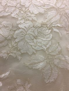 white lace fabric with flowers and leaves on it