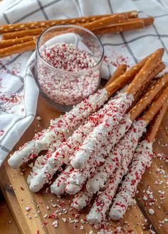 some pretzels are on a cutting board with sprinkles