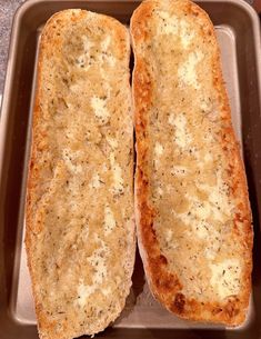 two pieces of bread sitting on top of a pan