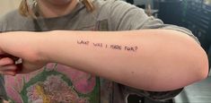 a woman with a tattoo that says what was i made today? on her arm