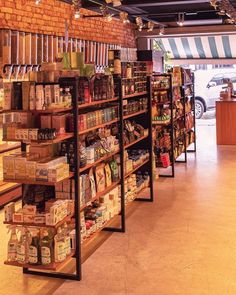 a store filled with lots of different types of food and drinks on shelves next to each other