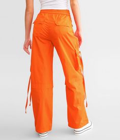 Vibrant M.I.U. Wide Leg Cargo Pant - Orange Large, Women's Orange Solid stretch pant Inseam measures 30 1/2 Rise measures 11 Elasticized cinch tie waistband Back snap flap pockets Cinch tie bottom openings. 65% Cotton 32% Polyester 3% Spandex. Hand wash cold water inside out. Do not bleach. Do not tumble dry. Do not iron.. WOMEN'S BOTTOMS SIZE CONVERSION CHART Waist (size) 22 23 24 25 26 27 28 29 30 31 32 33 34 36 38 Juniors - 00 0 1 3 5 7 9 11 13 15 - - - - US - - 00 0 2 4 6 8 10 12 14 16 18 20 Pant For Women, Women's Bottoms, Conversion Chart, Cargo Pants Women, Cargo Pant, Stretch Pants, Waist Size, Womens Bottoms, Cold Water