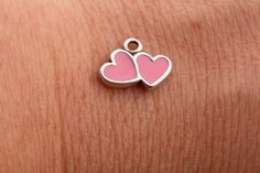 Pink Enamel Double Heart Charm for Permanent Jewelry Material: sterling silver with pink enamel Size: 5mm x 10mm How many pieces: available 1-5, 10, 15, 20 pieces. If you need more quantities, please send us a convo. These pink enamel double hearts charm are adorable! The back of the heart charm is flat. Super cute charm to add to your permanent jewelry collection! Check out our chains section: https://www.etsy.com/shop/MilanPersonalized?ref=seller-platform-mcnav§ion_id=39974974 Check out our co Pink Heart Beads Jewelry For Anniversary, Sterling Silver Jewelry With Pink Heart Beads, Nickel-free Pink Heart Cut Jewelry, Personalized Double Heart Pink Jewelry, Personalized Pink Double Heart Jewelry, Pink Enamel Heart Pendant Jewelry, Pink Hypoallergenic Jewelry For Valentine's Day, Nickel-free Pink Jewelry For Anniversary, Pink Enamel Dainty Jewelry