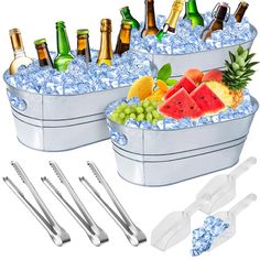 two ice buckets filled with watermelon, pineapple and other beverages