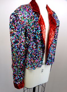 "This is such a colorful vintage piece! It's completely hand embellished with bright and colorful sequins and is in excellent condition! Measurements are taken with the front brought together and both bottom closures intact. Bust - 48\" Waist - 40\" (taken around bottom hem) Length - 19\" Tag Size - Extra Large All of my items come from a smoke-free and pet-free home. If you have any questions, please don't hesitate to ask!" Red Sequined Outerwear For Party, Multicolor Sequined Party Outerwear, Party Multicolor Sequined Outerwear, Multicolor Sequined Outerwear For Party Season, Fitted Multicolor Outerwear For Party, Fitted Multicolor Sequined Outerwear, Multicolor Embellished Party Outerwear, Embellished Multicolor Party Outerwear, Prom Jacket