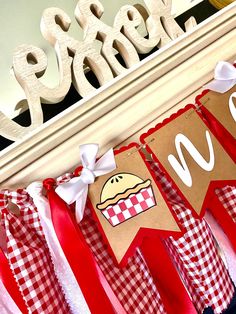 a red and white checkered bunting banner with the word hot dog on it