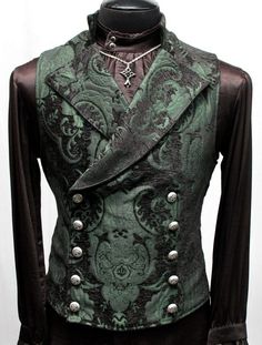 An elegant double breasted vest for formal occasions. A fitted vest made in rich dark green and black tapestry fabric with a stand up top collar and wide sweeping lapels. Fastens on the inside with a sturdy button and buttons on the outside with five engraved metal buttons. The vest back and inside lining is made from rich black satin. Comes in sizes Small-3X. Wonderful! Measurements: Small: Chest 39" Stomach 36" Waist 34" Medium: Chest 42" Stomach 38" Waist 36" Large: Chest 44" Stomach 42" Waist 40" XL: Chest 47" Stomach 45" Waist 43" XXL: Chest 49" Stomach 47" Waist 46" 3X: Chest 52" Stomach 50" Waist 49" Fitted Green Vest Outerwear, Fitted Green Vest For Fall, Victorian Tapestry, Steampunk Mode, Moda Steampunk, Steampunk Gadgets, Black Tapestry, Goth Steampunk, Gothic Vampire