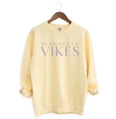 The perfect cozy sweatshirt for Vikings Football games! Product Details: * Relaxed fit, medium-heavy fabric * 80% ring-spun cotton, 20% polyester * Color: Butter * Unisex Fit; Please refer to the sizing chart in the listing photos to find your perfect fit! Care Details: * To maintain the quality of your sweatshirt, wash inside out on a delicate cycle and in cold water * Hang dry or lay flat to dry Shipping Details: * This product is made especially for you as soon as you place an order, which is why it takes a bit longer to deliver it to you.  * Please allow 1-2 weeks for processing, thank you! Yellow Letter Print Sweatshirt For Fall, Cozy French Terry Tops For Streetwear, Yellow Sporty Sweatshirt With Relaxed Fit, Yellow Sporty Relaxed Fit Sweatshirt, Yellow Relaxed Fit Sporty Sweatshirt, Comfy Cotton Sweatshirt, Cozy Relaxed Fit Fleece Tops, Cozy Fleece Tops With Relaxed Fit, Comfy Cozy Fit Fleece Sweatshirt