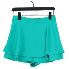 Add Flair To Your Style With This Emerald Green Zara Bermuda Skort. Designed To Look Like A Skirt But With The Practicality Of Built-In Shorts, It Features A Ruffled Design And A Side Zipper. Worn Just A Few Times, It Looks Brand New. While Labeled Xs, It Fits Slightly Larger But Is Still Snugger Than A Standard Small. Perfect For Any Occasion Where You Want To Stand Out. Chic Green Bottoms With Ruffles, Chic Green Ruffled Bottoms, Green Ruffled Bottoms For Day Out, Casual Party Shorts With Ruffles, High-waist Green Ruffled Bottoms, Chic Green Ruffled Skirt, Zara Ruffled Summer Bottoms, Casual Green Shorts With Ruffles, Casual Green Ruffled Shorts