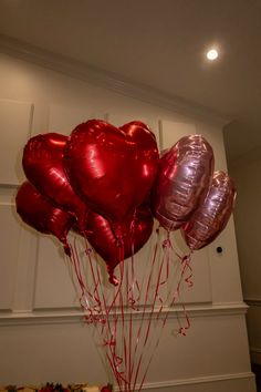 red and silver heart shaped balloons in a vase