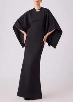 Channel underrated chic with our stretch kimono gown-a timeless wardrobe staple for the fashion-forward woman. The brooch beaded neck and flowy sleeves add a touch of playful charm while maintaining an air of elegance, making it the perfect balance of fun and formal. The hip hugging crepe fabric not only enhances your figure, but also adds a dramatic and graceful flair at the hem as you move. This elegant design is perfect for any special occasion day or night. Details: Brooch Neck Detail Flowy Kimono Gown, Stylist Outfit, Crepe Material, Black Dress Formal, Timeless Wardrobe, Timeless Wardrobe Staples, Flowy Sleeves, Sleeve Wedding Dress, Nude Pumps