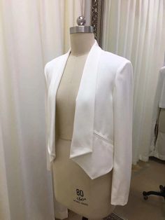 a mannequin with a white jacket on it