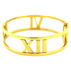 Tiffany & Co. Atlas 18k Yellow Gold Bangle Bracelet, Italian A simple, modern 18 karat yellow gold bangle bracelet featuring Roman numerals; marked Atlas, Tiffany & Co., Au750, Italy Size: width 1.7 cm; inner circumference 16.5 cm Total weight: 37.2 grams Gold Bracelet Tiffany & Co., Tiffany Atlas Bracelet, Luxury Yellow Gold Enamel Bangle, Luxury 14k Gold-tone Gold Bracelet, Luxury Vintage Gold-tone Bracelets, Tiffany And Co Bracelet, Yellow Gold Bangle, Modern Bracelets, Gold Bangle Bracelet