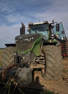 a tractor is parked in the middle of a field